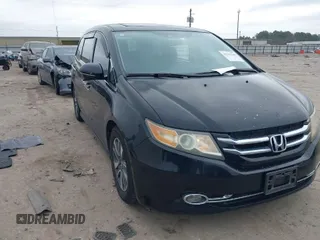 2014 Honda Odyssey Touring with VIN 5FNRL5H9XEB045695, listed as a IAAI auction lot 41545348 with 131,472 mi miles and . Bid and sale history available at carsss.com. Image 1.