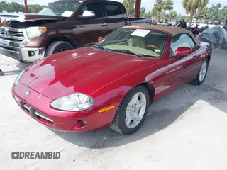 1997 Jaguar XK with VIN SAJGX274XVC004952, listed as a IAAI auction lot 42211023 with 109,889 mi miles and . Bid and sale history available at DreamBid. Image 2.