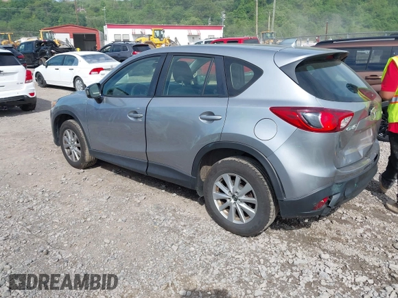 2014 Mazda CX-5 Sport with VIN JM3KE2BE9E0423737, listed as a IAAI auction lot 42222646 with 116,160 mi miles and . Bid and sale history available at DreamBid. Image 3.