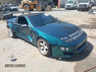 1993 Nissan 300ZX z VIN JN1RZ27H4PX001807, wystawiony jako IAAI lot #42160056 z przebiegiem 132 863 mil mil oraz . Historia ofert i sprzedaży dostępna na DreamBid. Obrazek 1.
