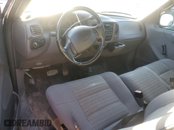 2002 Ford F-150 XL with VIN 1FTRF18232NA58109, listed as a Copart auction lot 88929065 with 148,228 mi miles and Salvage title. Bid and sale history available at DreamBid. Image 8.