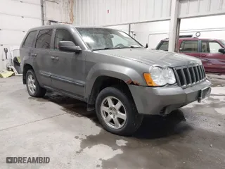 2008 Jeep Grand Cherokee Laredo with VIN 1J8GR48K58C119411, listed as a IAAI auction lot 41637142 with 212,729 mi miles. Bid and sale history available at carsss.com. Image 1.