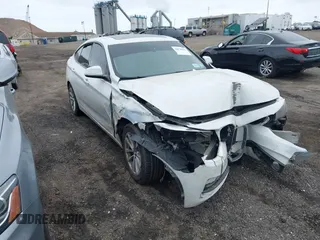 2014 BMW 3 Series GT 328i xDrive with VIN WBA3X5C5XED559713, listed as a IAAI auction lot 42078622 with 68,233 mi miles. Bid and sale history available at carsss.com. Image 1.