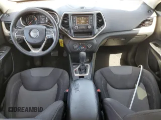 2016 Jeep Cherokee Altitude with VIN 1C4PJLAB2GW126428, listed as a Copart auction lot 56149585 with 214,359 mi miles and Salvage Title. Bid and sale history available at DreamBid. Image 8.