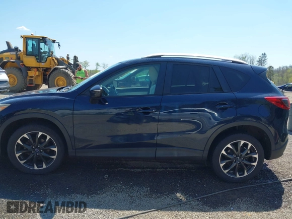 2016 Mazda CX-5 Grand Touring with VIN JM3KE4DY5G0681369, listed as a IAAI auction lot 42102805 with 128,182 mi miles and . Bid and sale history available at DreamBid. Image 14.