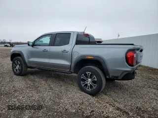 2023 GMC Canyon 4WD AT4 with VIN 1GTP6DEK5P1170230, listed as a Copart auction lot 52767295 with 26,769 mi miles and Salvage Title. Bid and sale history available at carsss.com. Image 2.
