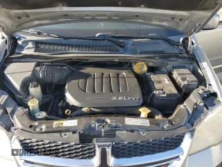 2014 Dodge Grand Caravan SXT with VIN 2C4RDGCG1ER121033, listed as a Copart auction lot 52030715 with 105,451 mi miles and Salvage Title. Bid and sale history available at DreamBid. Image 12.