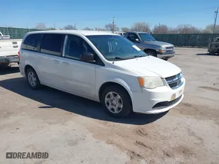 2012 Dodge Grand Caravan SE with VIN 2C4RDGBG0CR203656, listed as a IAAI auction lot 41842155 with 126,164 mi miles. Bid and sale history available at carsss.com. Image 1.