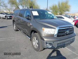 2012 Toyota Tundra with VIN 5TFEY5F1XCX128821, listed as a IAAI auction lot 41476529 with 108,872 mi miles and . Bid and sale history available at DreamBid. Image 1.