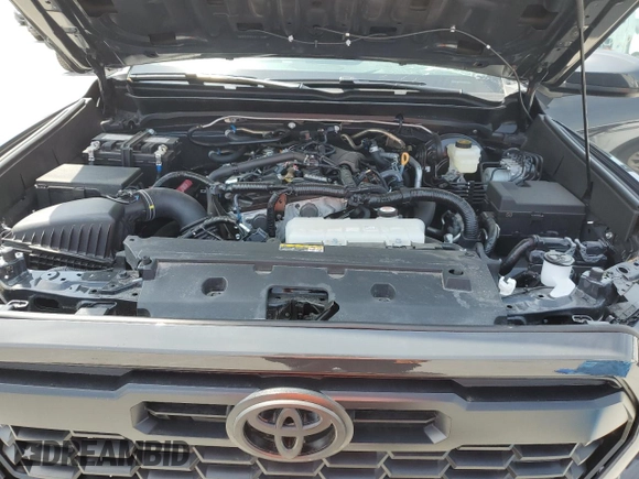 2024 Toyota Tacoma SR5 z VIN 3TMLB5JN6RM058039, wystawiony jako Copart lot #57168865 z przebiegiem 1 859 mil mil oraz Czysty tytuł • Clean title. Historia ofert i sprzedaży dostępna na DreamBid. Obrazek 11.