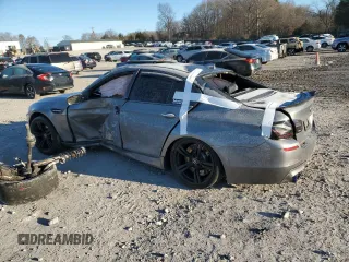 2014 BMW M5 z VIN WBSFV9C57ED593159, wystawiony jako Copart lot #87475634 z przebiegiem Nie podano mil oraz Szkody całkowita. Historia ofert i sprzedaży dostępna na DreamBid. Obrazek 2.