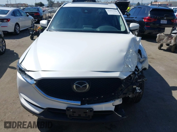 2020 Mazda CX-5 Grand Touring with VIN JM3KFADM0L1838495, listed as a IAAI auction lot 41991566 with 32,021 mi miles. Bid and sale history available at carsss.com. Image 12.