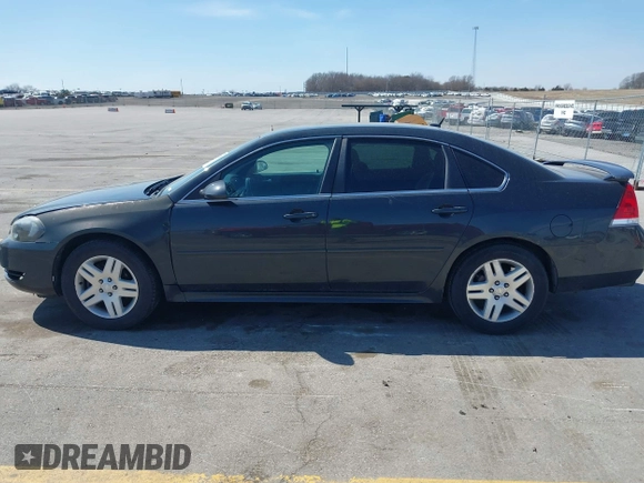 2013 Chevrolet Impala LT with VIN 2G1WB5E31D1163179, listed as a IAAI auction lot 41908130 with 190,801 mi miles and . Bid and sale history available at DreamBid. Image 14.