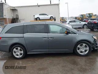 2011 Honda Odyssey Touring Elite with VIN 5FNRL5H9XBB090616, listed as a IAAI auction lot 41944510 with 207,962 mi miles and . Bid and sale history available at DreamBid. Image 14.