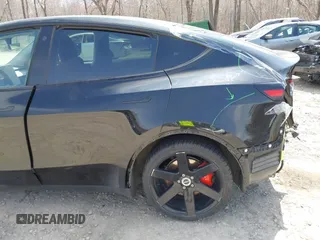 2022 Tesla Model Y Performance with VIN 7SAYGDEF7NF310113, listed as a IAAI auction lot 42038407 with 46,052 mi miles and . Bid and sale history available at DreamBid. Image 6.