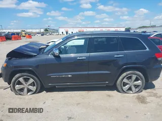 2015 Jeep Grand Cherokee High Altitude with VIN 1C4RJFCG5FC807394, listed as a IAAI auction lot 42452034 with 72,011 mi miles and . Bid and sale history available at DreamBid. Image 15.
