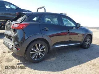 2016 Mazda CX-3 Grand Touring z VIN JM1DKBD79G0124504, wystawiony jako Copart lot #53663945 z przebiegiem 94 253 mil mil oraz Szkoda całkowita • Salvage title. Historia ofert i sprzedaży dostępna na DreamBid. Obrazek 3.