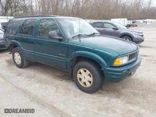 1997 Oldsmobile Bravada with VIN 1GHDT13W2V2706505, listed as a IAAI auction lot 41835475 with 131,247 mi miles. Bid and sale history available at carsss.com. Image 1.