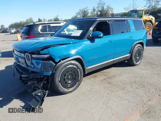 2025 Rivian R1S Adventure with VIN 7PDSGBBA9SN056202, listed as a IAAI auction lot 40766927 with 1,688 mi miles. Bid and sale history available at carsss.com. Image 17.