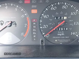 1998 Acura CL z VIN 19UYA3245WL000750, wystawiony jako IAAI lot #41987675 z przebiegiem 212 914 mil mil oraz . Historia ofert i sprzedaży dostępna na DreamBid. Obrazek 7.