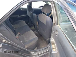 2003 Toyota Camry LE with VIN JTDBE32K130149032, listed as a IAAI auction lot 42063174 with 241,424 mi miles and . Bid and sale history available at DreamBid. Image 8.