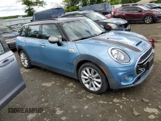 2017 MINI Clubman Cooper S z VIN WMWLU5C5XH2E83566, wystawiony jako Copart lot #57919305 z przebiegiem 89 983 mil mil oraz Tytuł czysty. Historia ofert i sprzedaży dostępna na DreamBid. Obrazek 4.