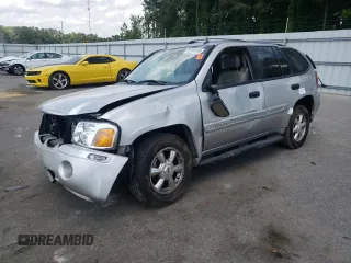 2005 GMC Envoy SLE with VIN 1GKDS13S352143555, listed as a Copart auction lot 55144345 with 201,189 mi miles and Salvage title. Bid and sale history available at DreamBid. Image 1.