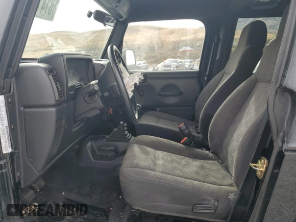 2003 Jeep Wrangler SE with VIN 1J4FA29113P351844, listed as a Copart auction lot 81411324 with 53,525 mi miles and Salvage title. Bid and sale history available at DreamBid. Image 7.