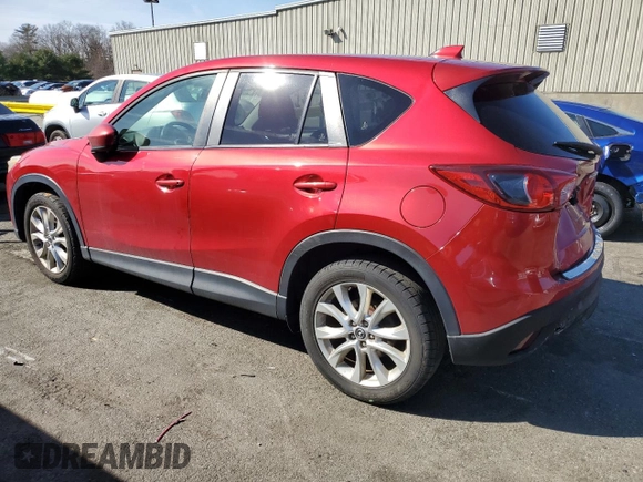 2014 Mazda CX-5 Grand Touring with VIN JM3KE4DY8E0421660, listed as a Copart auction lot 48588525 with 144,939 mi miles and Salvage Title. Bid and sale history available at DreamBid. Image 2.