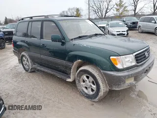 2000 Toyota Land Cruiser with VIN JT3HT05J8Y0084239, listed as a IAAI auction lot 41440548 with 240,000 mi miles. Bid and sale history available at carsss.com. Image 1.