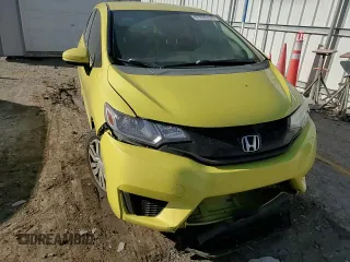 2015 Honda Fit LX with VIN 3HGGK5H51FM717584, listed as a Copart auction lot 87038334 with 143,447 mi miles and Salvage Title. Bid and sale history available at carsss.com. Image 11.