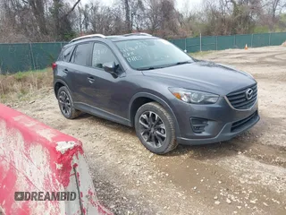 2016 Mazda CX-5 Grand Touring with VIN JM3KE4DYXG0830150, listed as a IAAI auction lot 41961007 with 142,570 mi miles and . Bid and sale history available at DreamBid. Image 1.