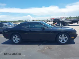 2012 Dodge Challenger SXT Plus с VIN 2C3CDYAG2CH181070, выставлен на аукционе IAAI как лот 42597826 с пробегом 94 634 миль миль и . История ставок и продаж доступна на DreamBid. Изображение 13.