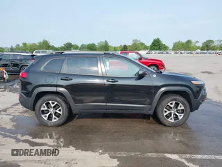2015 Jeep Cherokee Trailhawk with VIN 1C4PJMBS6FW786622, listed as a IAAI auction lot 42403215 with 148,205 mi miles and . Bid and sale history available at DreamBid. Image 13.