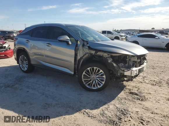 2022 Lexus RX with VIN 2T2JZMAA8NC256470, listed as a Copart auction lot 82873304 with 14,614 mi miles and Salvage Title. Bid and sale history available at carsss.com. Image 4.
