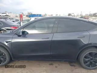 2024 Tesla Model Y with VIN 7SAYGDED8RF116209, listed as a IAAI auction lot 41761804 with 12,048 mi miles and . Bid and sale history available at DreamBid. Image 14.