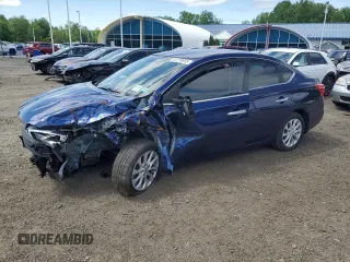 2019 Nissan Sentra S z VIN 3N1AB7AP8KY335652, wystawiony jako Copart lot #57279915 z przebiegiem 74 677 mil mil oraz Czysty tytuł • Clean title. Historia ofert i sprzedaży dostępna na DreamBid. Obrazek 1.