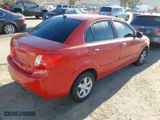 2010 Kia Rio LX with VIN KNADH4A34A6612529, listed as a IAAI auction lot 41859726 with 199,580 mi miles. Bid and sale history available at carsss.com. Image 4.