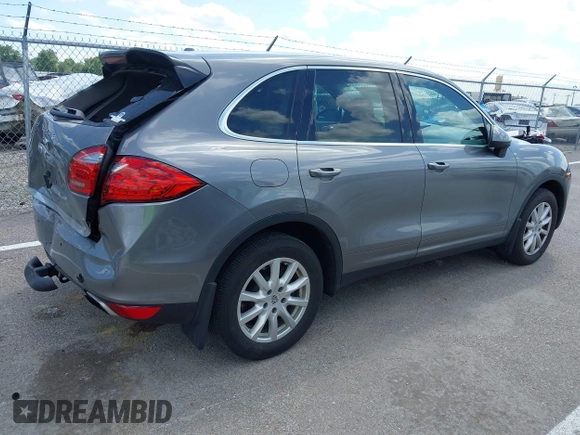 2014 Porsche Cayenne z VIN WP1AA2A2XELA91523, wystawiony jako IAAI lot #42538298 z przebiegiem 67 001 mil mil oraz . Historia ofert i sprzedaży dostępna na DreamBid. Obrazek 4.