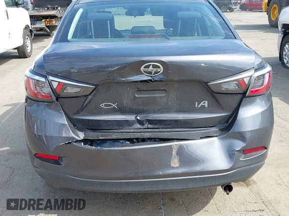 2016 Scion iA with VIN 3MYDLBZV2GY129703, listed as a IAAI auction lot 41787371 with 77,459 mi miles. Bid and sale history available at carsss.com. Image 6.