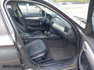 2014 BMW X1 sDrive28i with VIN WBAVM1C52EVW56134, listed as a IAAI auction lot 41941829 with 85,839 mi miles. Bid and sale history available at carsss.com. Image 5.