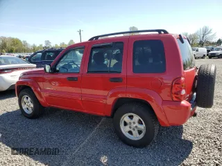 2002 Jeep Liberty Limited with VIN 1J8GL58K42W328443, listed as a Copart auction lot 52768345 with 218,459 mi miles and Salvage title. Bid and sale history available at DreamBid. Image 2.