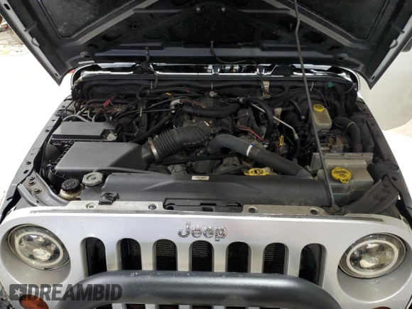 2008 Jeep Wrangler Unlimited Sahara с VIN 1J8GA59108L514034, выставлен на аукционе Copart как лот 58812215 с пробегом 191 800 миль миль и Списание • Salvage title. История ставок и продаж доступна на DreamBid. Изображение 12.