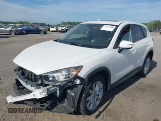 2015 Mazda CX-5 Grand Touring with VIN JM3KE2DY5F0498718, listed as a IAAI auction lot 42070000 with 129,327 mi miles. Bid and sale history available at carsss.com. Image 20.