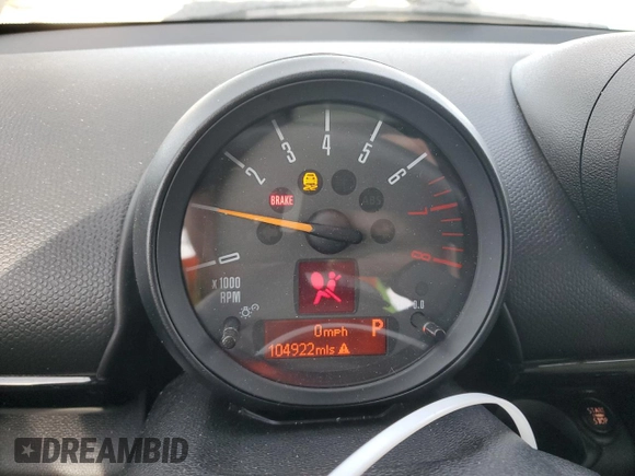 2015 MINI Countryman S with VIN WMWZC5C57FWP48606, listed as a Copart auction lot 47212255 with 104,922 mi miles and Salvage Title. Bid and sale history available at DreamBid. Image 9.