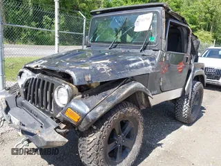 2003 Jeep Wrangler Sport z VIN 1J4FA49S53P317779, wystawiony jako IAAI lot #42388780 z przebiegiem Nie podano mil oraz . Historia ofert i sprzedaży dostępna na DreamBid. Obrazek 6.
