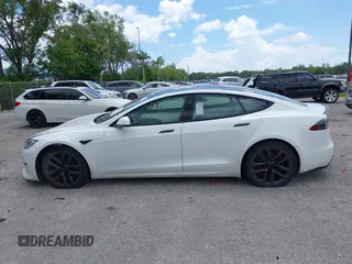 2022 Tesla Model S Plaid with VIN 5YJSA1E61NF460155, listed as a IAAI auction lot 42545167 with 51,711 mi miles and . Bid and sale history available at DreamBid. Image 14.