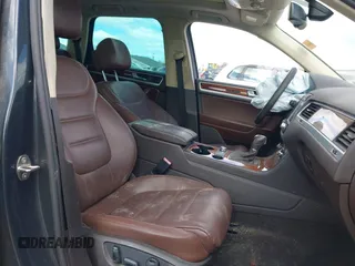 2013 Volkswagen Touareg Lux with VIN WVGEF9BP4DD006851, listed as a IAAI auction lot 41983791 with 115,551 mi miles and . Bid and sale history available at DreamBid. Image 5.
