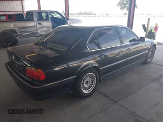 1999 BMW 7 Series 740il with VIN WBAGH8336XDP03839, listed as a IAAI auction lot 42067133 with 163,345 mi miles. Bid and sale history available at carsss.com. Image 4.