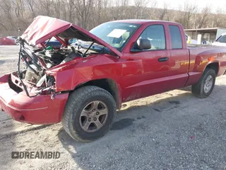 2006 Dodge Dakota SLT with VIN 1D7HW42N16S525329, listed as a IAAI auction lot 40920101 with 124,535 mi miles and . Bid and sale history available at carsss.com. Image 2.
